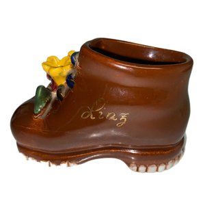 Brown Ceramic Baby Shoe Boot With Yellow Flowers Attached Planter